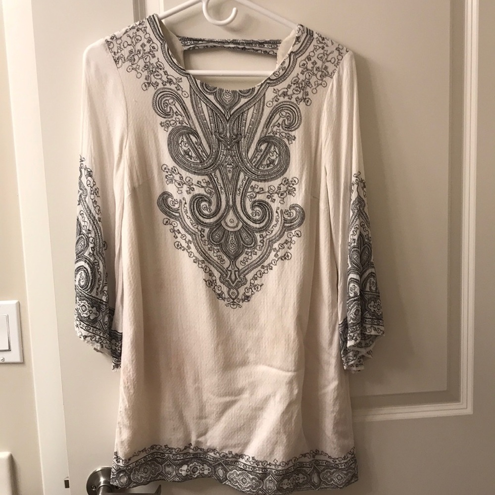 White long sleeve dress with a design